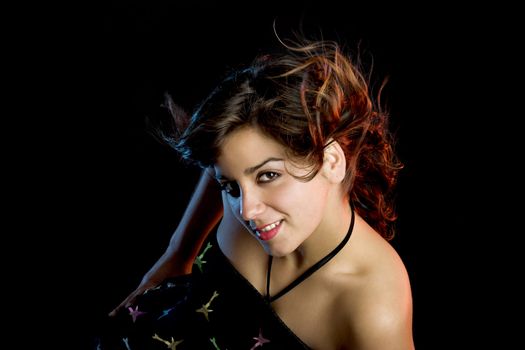 Portrait of a beautiful young and attractive woman on a black background