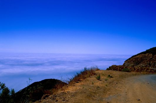 Big Sur is a sparsely populated region of the central California, United States coast where the Santa Lucia Mountains rise abruptly from the Pacific Ocean. The terrain offers stunning views, making Big Sur a popular tourist destination.