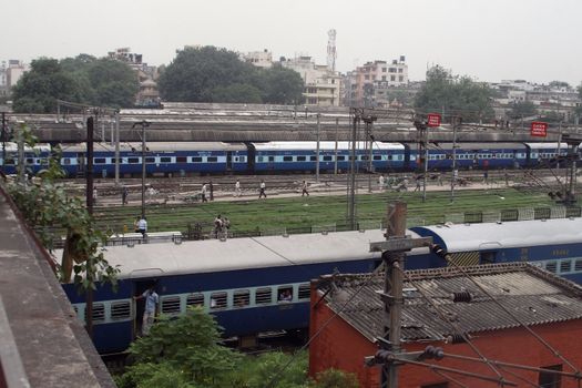 Two trains at the railway station in New Delhi - India