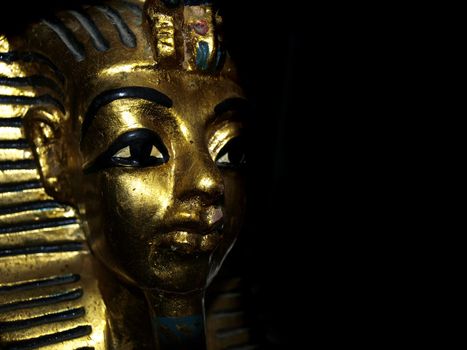 Gold mask motif of the ancient boy Pharaoh in Egypt