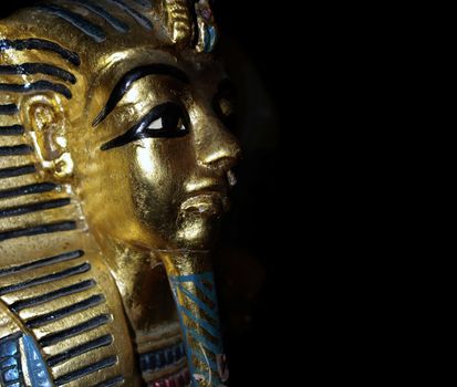 Gold mask motif of the ancient boy Pharaoh in Egypt