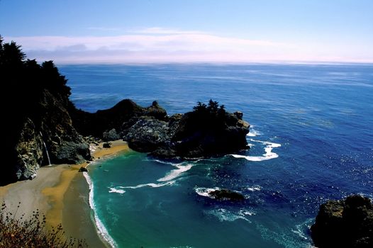 Big Sur is a sparsely populated region of the central California, United States coast where the Santa Lucia Mountains rise abruptly from the Pacific Ocean. The terrain offers stunning views, making Big Sur a popular tourist destination.