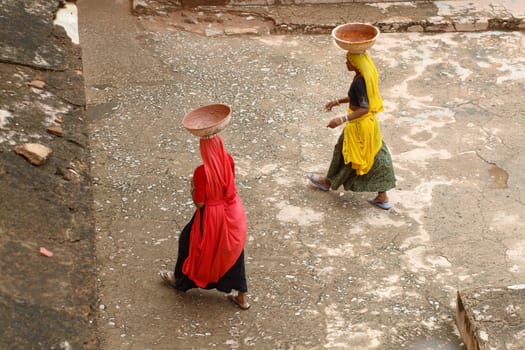 Indian lady wearing red and yellow sari 