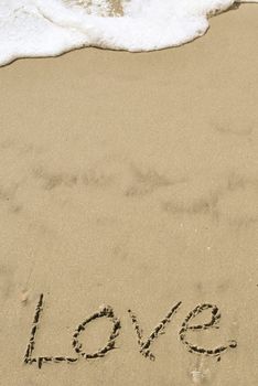 Love written in the sand with wave 10