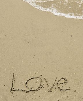 Love written in the sand with wave 33