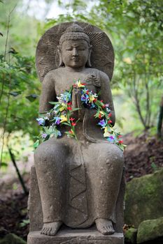 Buddha decorated with flowers - horizontal format
