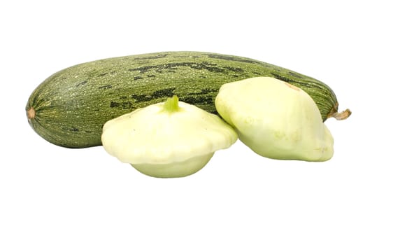 Zucchini and two bush pumpkins it is isolated on a white background.