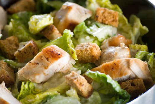 Fresh Caesar salad with crunchy croutons and Parmesan cheese 