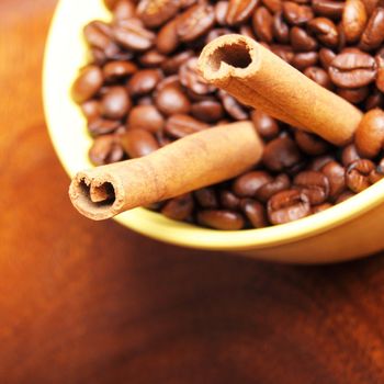 coffee beans and cinnamon with copyspace showing food concept