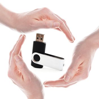 usb stick or flash drive with hands isolated on white background