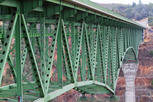 Long tall old green metal and concrete bring in mountains