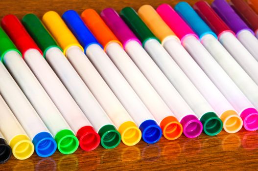 Back to school, set of color markers on the table.