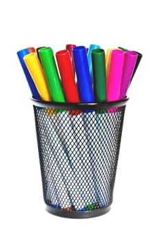 Colored markers in a cup on a white background.