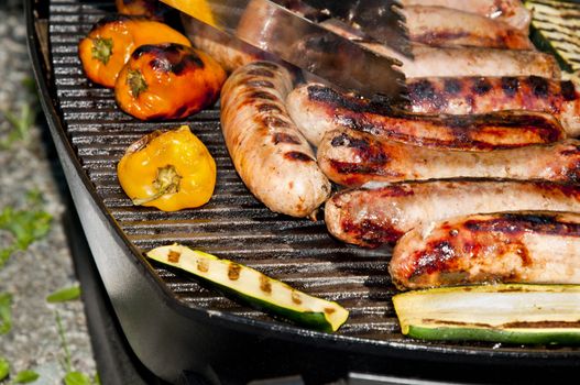 Sausage, zucchini and peppers grilled during the camp.