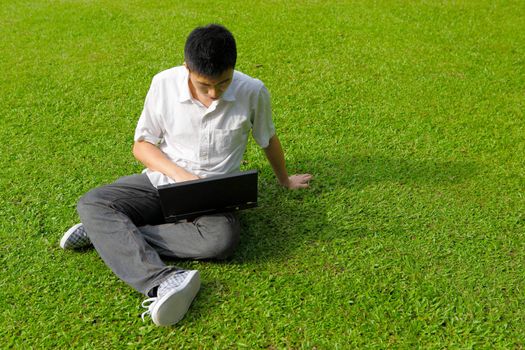 man using computer outdoor