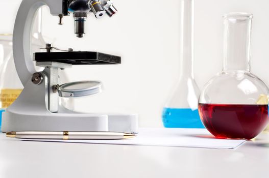 workplace employee lab,flasks with colored liquids, laboratory items