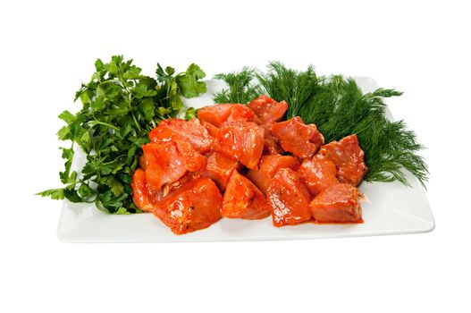 Shashlik or Shish Kebab on a plate with dill and parsley