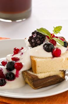 Dessert cake with yoghurt, fruits and mint leaf