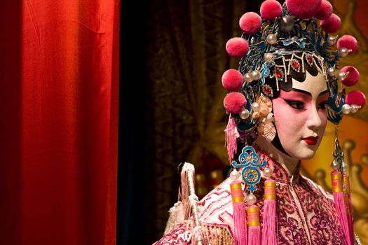 chinese opera dummy and red cloth as text space ,it is a toy,not real man 