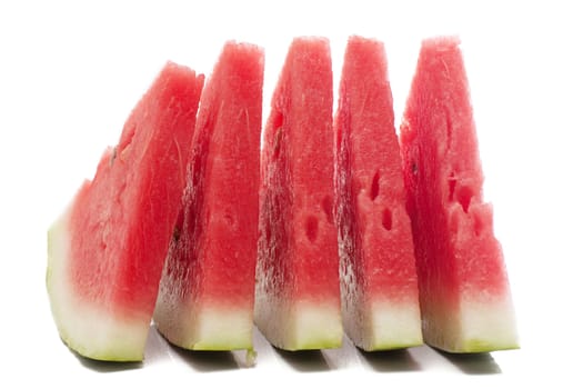 Five pieces of watermelon isolated over white.