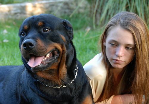 young woman and her best friend purebred rottweiler
