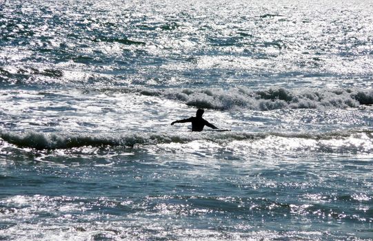 A man who is surfing off the Brighton Coast.