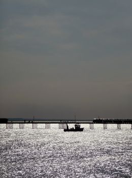 A boat that is by the pier in Southend.