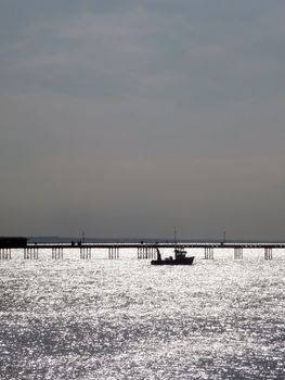 A boat that is by the pier in Southend.
