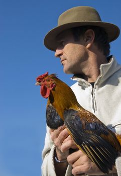 beautiful french man with hat and his rooster