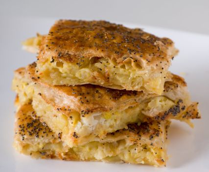 Three potato pies with sesame seeds