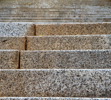 Focused near steps with many upward leading stairs in background