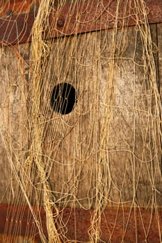 traditional fishing net and wooden barrel