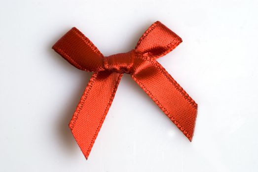red ribbon tied in a bow