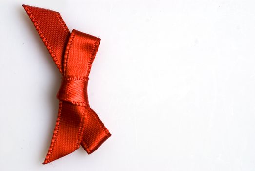 red ribbon tied in a bow