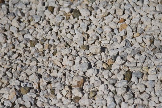 Ground covering of small rocks in different shades