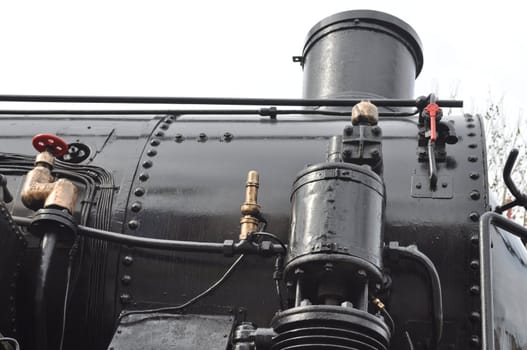 Detail of ancient steam train locomotive vehicle