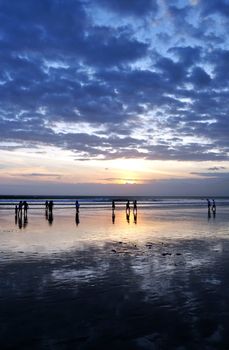 Bali beach at sunset, Kuta, Bali, Indonesia.