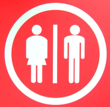 A toilet sign for ladies and gents