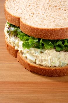 Tuna salad sandwich on wheat bread with lettuce