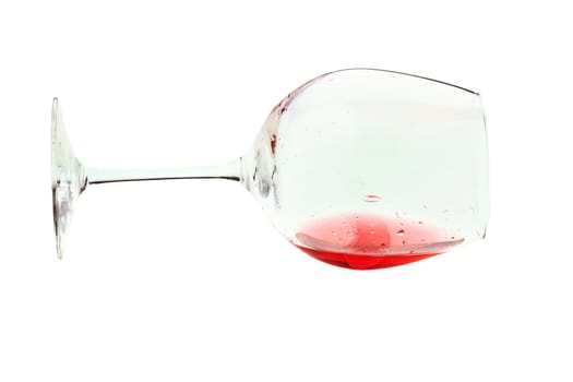 Wine glass tipped over. Isolated on white with clipping path.