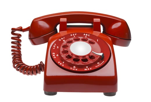 Red 60s rotary dial phone isolated with clipping path