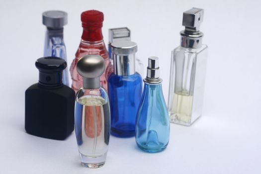 Bottles of fragrances focus on one bottle shallow dof