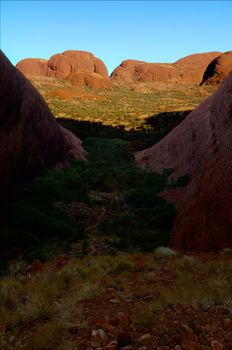 Huge monolithic blocks of red color in sun beams. One of the most ancient monoliths in the world.The Olgas - Kata Tjuta, Australia.