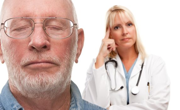 Concerned Senior Man and Female Doctor Behind with Selective Focus the Gentleman in front.