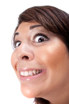 Woman with a funny look on her face smiles over a white background.