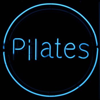 Pilates Neon Blue Sign with Black Background