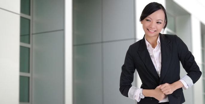 Asian lady with joy, closeup portrait outside of office.