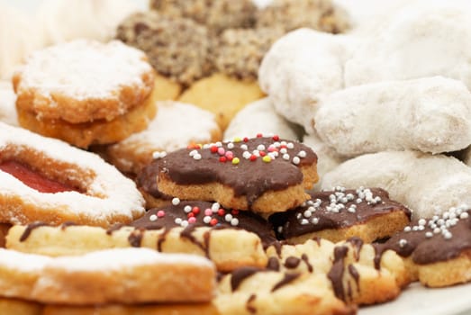 Different Christmas cakes with chocolate, cookie and sugar