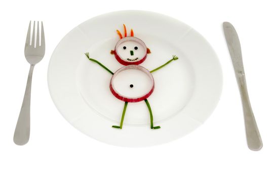 Man made of vegetables on a dish.