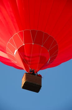 Red balloon flying in the air.